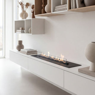 Modern living room with white walls, wooden shelves, and a built-in fireplace.