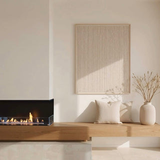 Modern living room with a fireplace, wooden bench, and decorative items.